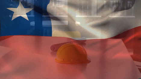 Animation-of-flag-of-chile-waving-over-yellow-helmet-and-floor-plan-on-table-against-glass-window