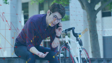 Animation-of-graphs,-changing-numbers,-asian-sitting-beside-bicycle-and-talking-on-smartphone