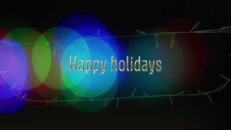 Animation-of-happy-holidays-text-and-fairy-lights-on-black-background