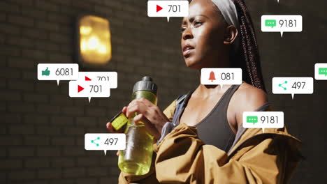 Animation-of-icons,-changing-numbers,-african-american-female-athlete-drinking-water
