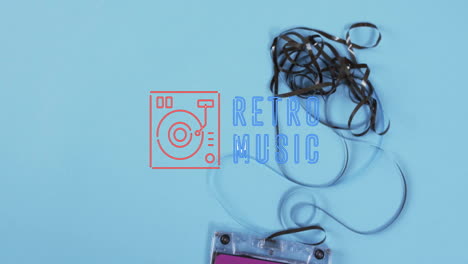 Animation-of-retro-music-text-over-tape-on-blue-background