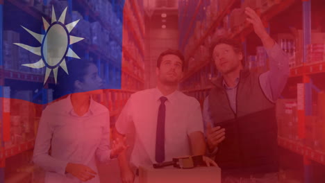 Animation-of-flag-of-taiwan-over-diverse-colleagues-discussing-in-warehouse