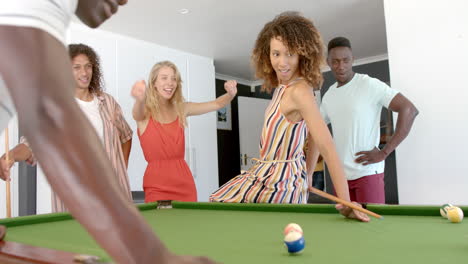 Diverse-group-of-friends-enjoy-a-game-of-pool-at-home