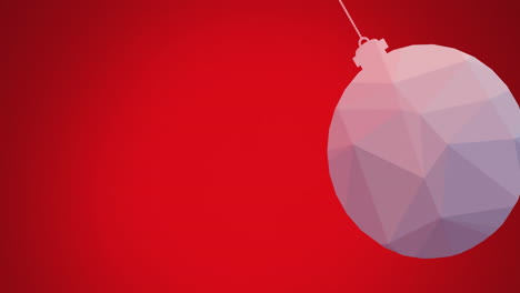 Animation-of-close-up-of-hanging-bauble-swinging-against-red-background
