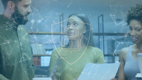 Animation-of-padlock-in-shield-and-connected-dots-over-diverse-coworkers-discussing-reports