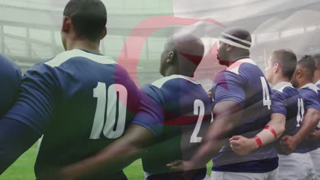 Animation-of-flag-of-algeria-over-diverse-male-rugby-players-at-anthem-at-stadium