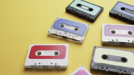 Video-of-retro-tapes-with-copy-space-on-yellow-background