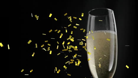 Animation-of-confetti-falling-over-champagne-glass