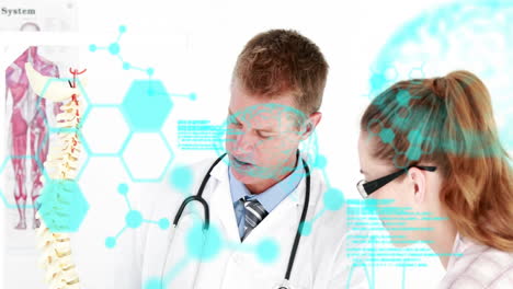 Animation-of-medical-data-processing-over-caucasian-male-and-female-doctor-discussing-spine