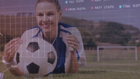 Animation-of-financial-data-processing-over-caucasian-female-football-player-on-field