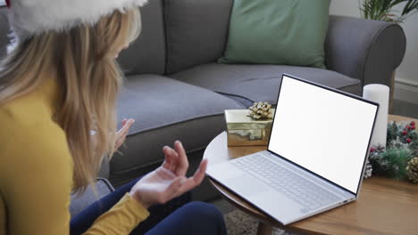 Happy-blonde-caucasian-woman-having-christmas-laptop-video-call,-with-copy-space,-slow-motion