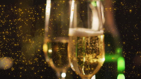 Animation-of-confetti-falling-over-champagne-glasses