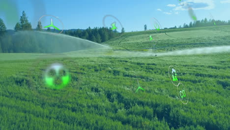 Animation-Von-Ökologie-Symbolen-über-Der-Landschaft-Mit-Wassersprinklern-Auf-Dem-Feld