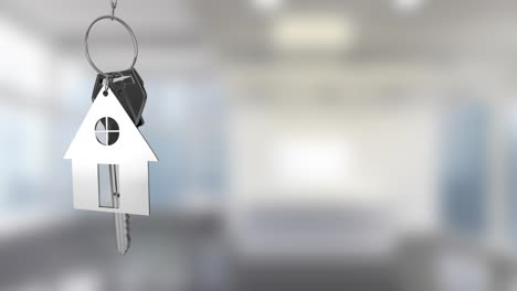 Animation-of-silver-key-with-house-key-fob-and-copy-space-over-out-of-focus-interiors