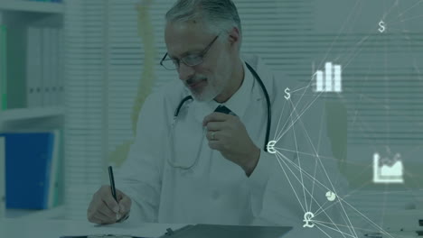 Animation-of-network-of-economy-icons-over-caucasian-male-doctor-at-desk