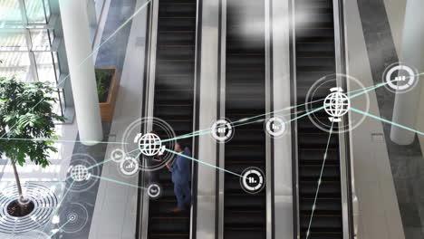 Animation-of-network-of-connections-with-icons-over-diverse-business-people-on-escalator