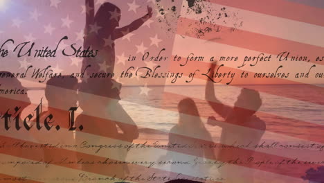 Animation-of-text-of-constitution-and-usa-flag-over-friends-celebrating-at-beach