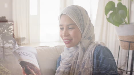 Animation-Von-Lichtpunkten-über-Einer-Lesenden-Frau-Gemischter-Abstammung-Im-Hijab