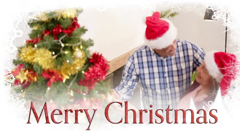 Animation-of-merry-christmas-text-over-diverse-senior-couple-celebrating-christmas-at-home
