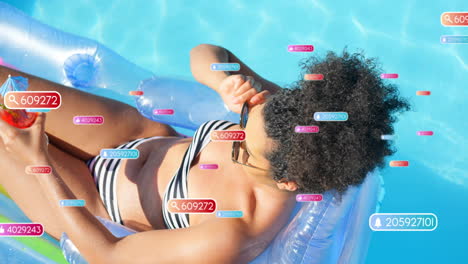 Animation-of-social-media-notifications-over-biracial-woman-sunbathing-in-pool