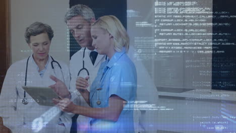 Animation-of-data-processing-over-caucasian-female-and-male-doctors-with-tablet-talking-in-hospital