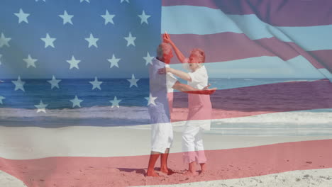 Animation-of-flag-of-usa-over-caucasian-senior-couple-dancing-on-beach-in-summer