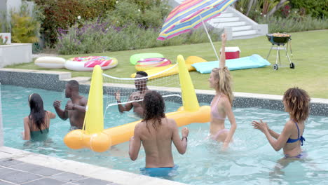 Diverse-group-enjoys-a-pool-game-at-a-home-outdoor-setting
