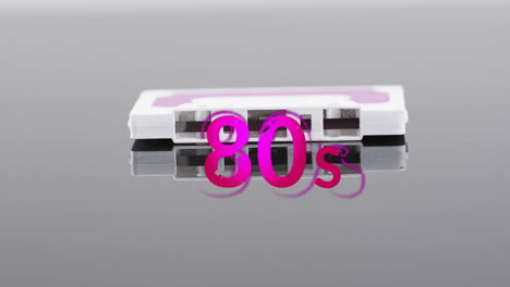 Animation-of-80s-text-over-white-tape