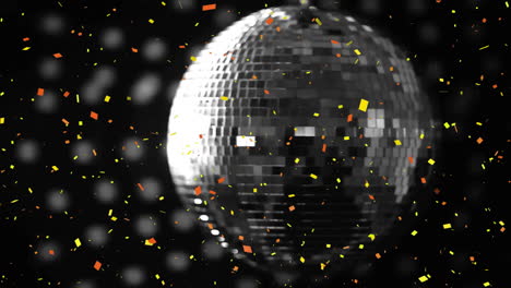 Animation-of-confetti-falling-over-mirror-disco-ball-on-black-background
