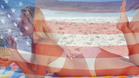 Animation-of-american-flag-over-caucasian-woman-relaxing-on-beach-by-sea