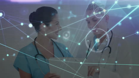 Animation-of-network-of-connections-with-icons-over-diverse-doctors