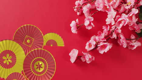 Animation-of-chinese-pattern-and-flowers-with-copy-space-on-red-background