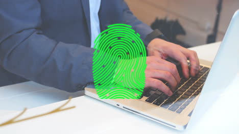 Animation-of-fingerprint-over-caucasian-businessman-using-laptop