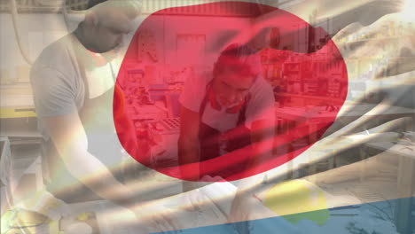 Animation-Der-Flagge-Japans-über-Kaukasischen-Männlichen-Tischlern,-Die-Baupläne-Besprechen