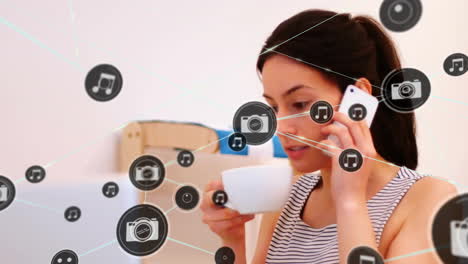 Animation-of-network-of-connected-icons-in-circles-over-biracial-woman-using-smartphone
