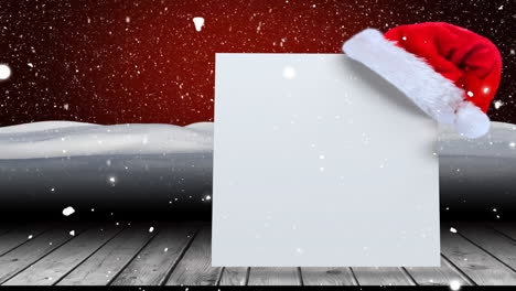 Animation-of-white-card-with-copy-space-and-snow-falling-with-santa-claus-hat