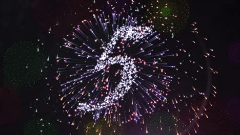 Animation-of-countdown-to-midnight-and-fireworks-on-black-background