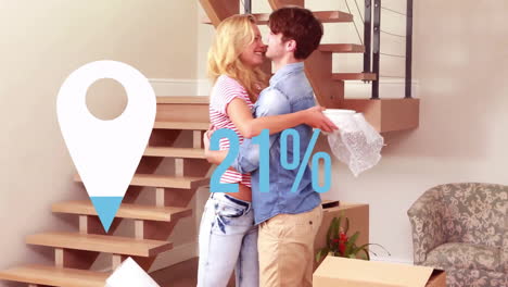 Animation-of-blue-location-pin-and-percent-over-caucasian-couple-with-boxes-moving-in-to-new-home