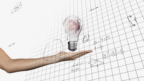 Animation-of-light-bulb-with-brain-over-woman's-hand-and-mathematical-data-processing