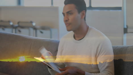 Animation-of-biracial-man-reading-book-and-sunset