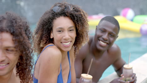 Biracial-woman-and-African-American-man-enjoy-a-pool-party