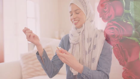 Animation-Von-Roten-Rosen-über-Einer-Gemischtrassigen-Frau-Im-Hijab,-Die-Lächelt-Und-Parfüm-Verwendet