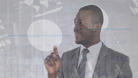 Animation-of-financial-data-processing-over-african-american-businessman-in-office