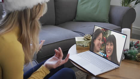 Happy-diverse-female-friends-having-christmas-laptop-video-call,-slow-motion