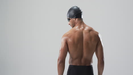 Athletic-biracial-athlete-swimmer-ready-for-a-swim,-with-copy-space