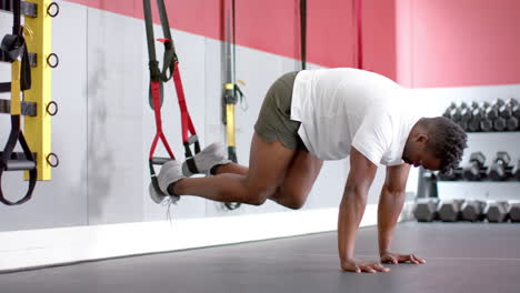 Fit-African-American-man-performing-a-workout-at-the-gym