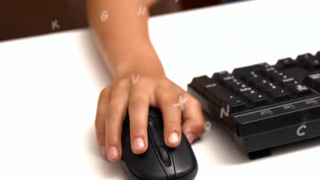 Animation-of-letters-over-hand-of-biracial-schoolboy-using-computer-mouse-at-school