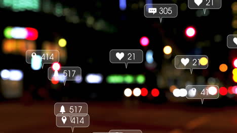 Animation-of-social-media-icons-and-data-processing-over-city-lights