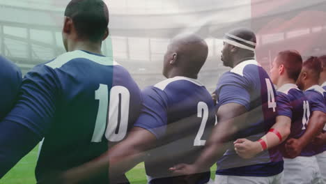 Animation-Der-Französischen-Flagge-über-Verschiedenen-Männlichen-Rugbyspielern,-Die-Im-Stadion-Die-Nationalhymne-Singen