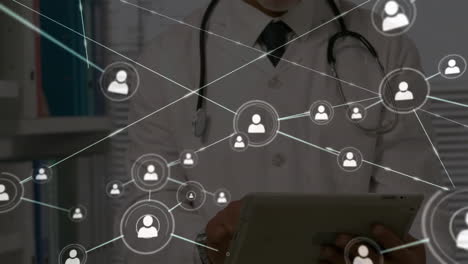 Animation-of-network-of-connections-with-icons-over-caucasian-male-doctor